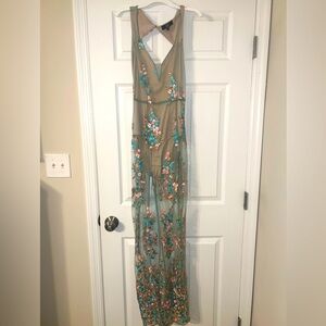 NEW Gorgeous sheer floral dress with nude colored bodysuit attached inside.